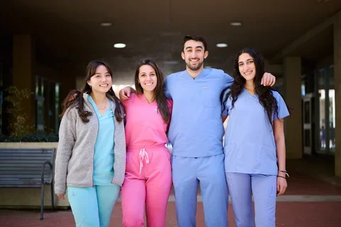A student group picture in the dentistry's breezeway.